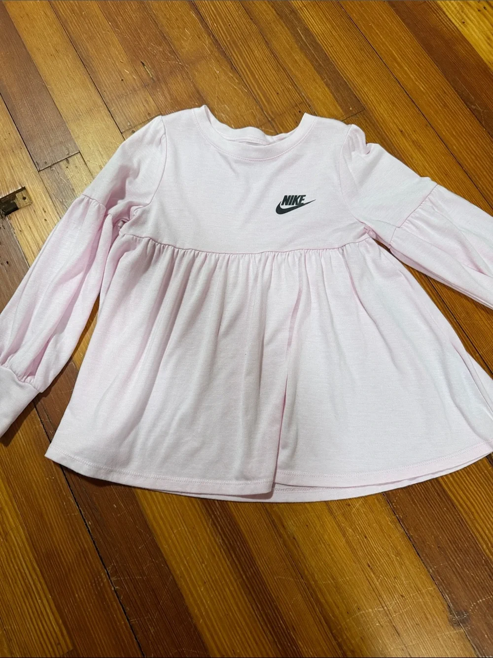 Nike Pink Ruffle-Detail Long Sleeve Top with Black Patterned Leggings